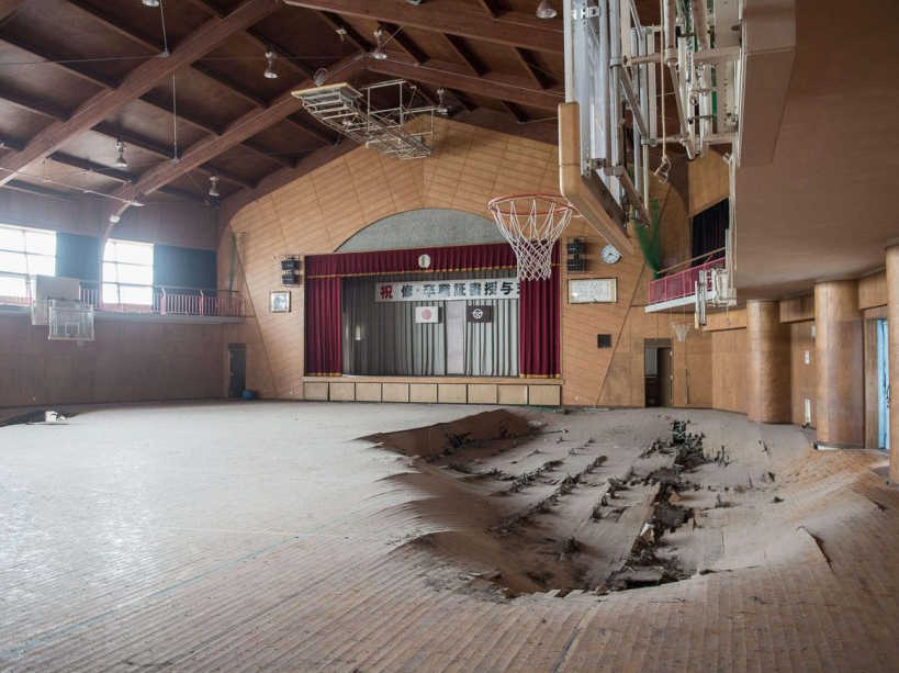EXCLUSIVE. SPECIAL FEES APPLY . MANDATORY CREDIT: Arkadiusz Podniesinski/REX Shutterstock Mandatory Credit: Photo by Arkadiusz Podniesinski/REX Shutterstock (5224634be) A school gymnasium with holes in the floor Fukushima, Japan - Sep 2015 FULL COPY: http://www.rexfeatures.com/nanolink/r7ku MINIMUM USE FEE A photographer has taken stunning and revealing pictures of the exclusion zone from the 2011 Fukushima Nuclear Disaster. Within a 20km radius the radioactive exclusion zone demonstrates the dangerous nature of nuclear energy. A network of abandoned towns and villages that once housed hundreds of thousands of people, the exclusion zone of the largest nuclear accident since Chernobyl is eerie and frightening. /EXCL_Rex_Fukushima_06/EXCLUSIVE. SPECIAL FEES APPLY . MANDATORY CREDIT: Arkadiusz Podniesinski/REX Shutterstock/1510071745