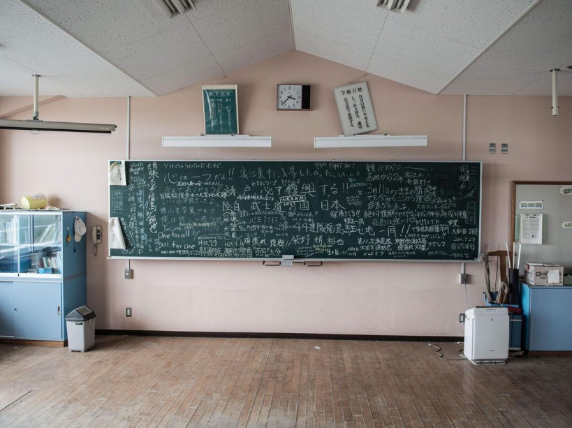 EXCLUSIVE. SPECIAL FEES APPLY . MANDATORY CREDIT: Arkadiusz Podniesinski/REX Shutterstock Mandatory Credit: Photo by Arkadiusz Podniesinski/REX Shutterstock (5224634bc) One of the classrooms on the first floor in a school. There is still a mark below the blackboard showing the level of the tsunami wave. On the blackboard in the classroom are words written by former residents, schoolchildren and workers in an attempt to keep up the morale of all of the victims, including "We can do it, Fukushima!" Fukushima, Japan - Sep 2015 FULL COPY: http://www.rexfeatures.com/nanolink/r7ku MINIMUM USE FEE A photographer has taken stunning and revealing pictures of the exclusion zone from the 2011 Fukushima Nuclear Disaster. Within a 20km radius the radioactive exclusion zone demonstrates the dangerous nature of nuclear energy. A network of abandoned towns and villages that once housed hundreds of thousands of people, the exclusion zone of the largest nuclear accident since Chernobyl is eerie and frightening. /EXCL_Rex_Fukushima_05/EXCLUSIVE. SPECIAL FEES APPLY . MANDATORY CREDIT: Arkadiusz Podniesinski/REX Shutterstock/1510071744